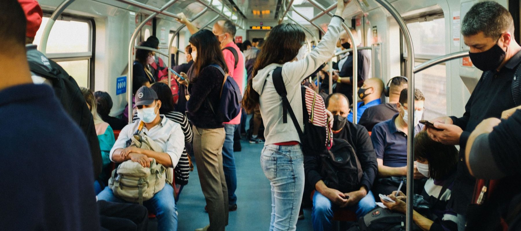 Public transport in Sao Paulo a woman holds on in a tube