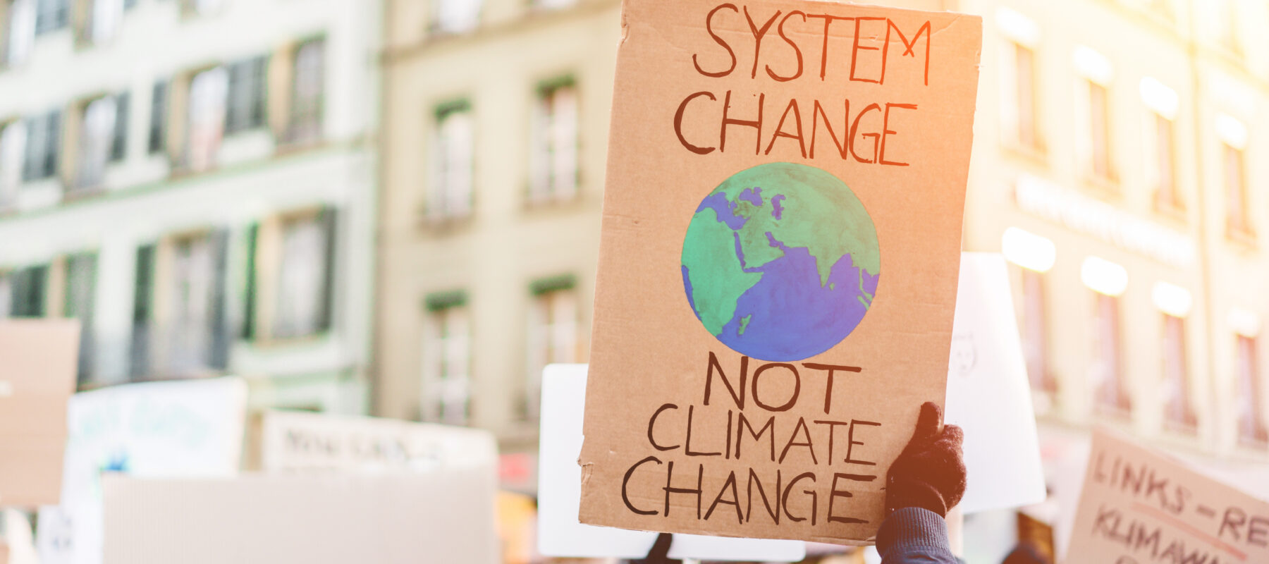 Group of demonstrators on road, young people fight for climate change - Global warming and enviroment concept - Focus on banner